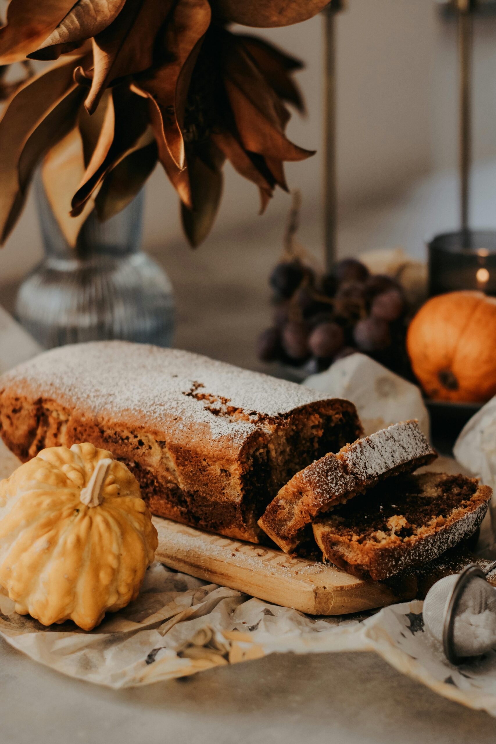 A loaf of bread with pumpkins and other fall decorations